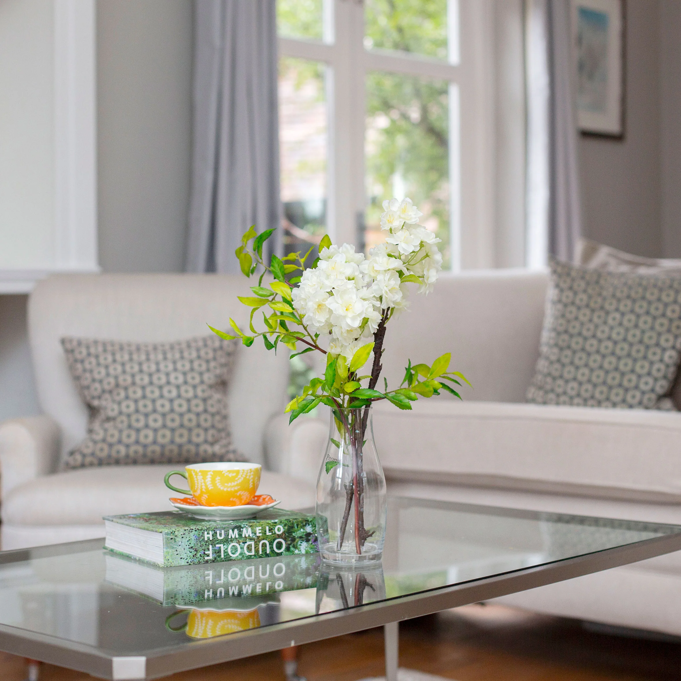 Artificial Blossom Stems in Glass Milk Bottle Vase - Image 3